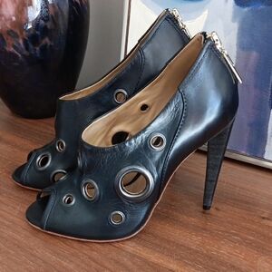 L.A.M.B. Black Stiletto Peep-Toe Heels with Silver Eyelets